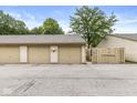 Individual garages with neutral doors, ample parking space, and secure access at 1044 Timber Creek Dr # 2, Carmel, IN 46032