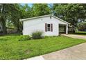 Attractive single-story house with lush green grass and a covered entry, creating a pleasant atmosphere at 1120 W 5Th St, Greenfield, IN 46140
