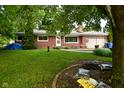 Charming single-story brick home with a well-maintained front yard, offering a welcoming curb appeal at 11522 Newport Dr, Indianapolis, IN 46236