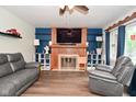 Inviting living room featuring a fireplace, hardwood floors, and a comfortable seating area at 11522 Newport Dr, Indianapolis, IN 46236