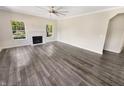 Spacious living room features hardwood floors and a stylish white fireplace at 1359 Shadow Ridge Rd, Indianapolis, IN 46280