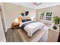 Cozy bedroom featuring hardwood floors, natural light, and neutral decor at 1359 Shadow Ridge Rd, Indianapolis, IN 46280