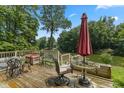 Spacious deck overlooking a tranquil lake is outfitted with comfortable outdoor furniture at 1927 E Derby Ct, Martinsville, IN 46151