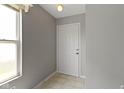 Light and bright entryway featuring neutral paint colors, a large window, and durable tile flooring at 3423 Summer Breeze Cir, Indianapolis, IN 46239