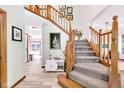Welcoming foyer with hardwood floors, a staircase, and natural light, creating an inviting entrance at 3715 Pitkin Rd, Martinsville, IN 46151