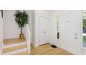 The foyer features hardwood floors, white trim and neutral paint, creating a welcoming and clean entrance at 4226 Cornelius Ave, Indianapolis, IN 46208