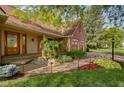 Attractive brick home featuring a landscaped entrance and a two-car attached garage at 5037 Surrey Ln, Carmel, IN 46033