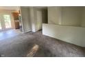 Spacious living room featuring neutral walls and carpeted floors ready to be updated at 667 E Edgewood Ave, Indianapolis, IN 46227
