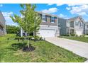 Attractive home with a well-maintained yard, complemented by a two-car garage and a glimpse of the surrounding community at 741 Scarsdale Ln, Danville, IN 46122