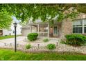 Charming home featuring a well-manicured lawn and inviting front porch at 7833 Meadow Bend Dr, Indianapolis, IN 46259