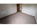 Spacious bedroom featuring neutral carpet, trim, and paint with a walk-in closet at 10150 Beresford Ct, Fishers, IN 46038
