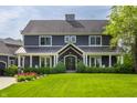 Inviting exterior of a two-story home with a manicured lawn and mature trees, offering great curb appeal at 10974 Harbor Bay Dr, Fishers, IN 46040