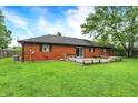 Lush backyard featuring a wooden deck, providing a serene outdoor living space at 11630 Deanna Dr, Indianapolis, IN 46229