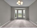 Bright dining room featuring a bay window allowing for an abundance of natural light and neutral carpeting at 15359 Manning Way, Westfield, IN 46074