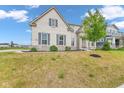 Charming two-story home featuring a combination of brick and stone facade with a well-maintained front yard at 15359 Manning Way, Westfield, IN 46074