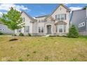 Charming two-story home featuring a combination of brick and stone facade with a well-maintained front yard at 15359 Manning Way, Westfield, IN 46074