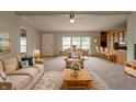 Open-concept living room and dining area featuring plush seating and abundant natural light at 3149 Carson Ave, Indianapolis, IN 46227