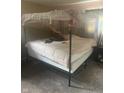 This bedroom features a four poster bed with sheer curtains, creating a relaxing and private space at 3570 Decamp Dr, Indianapolis, IN 46226