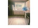 A functional kitchen featuring white cabinets and stainless steel appliances at 3570 Decamp Dr, Indianapolis, IN 46226