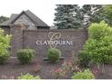 Welcoming brick community sign, beautifully landscaped with flowering plants and mature trees at 3795 Claybrook Ct, Bargersville, IN 46106