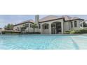 A refreshing swimming pool offers cool respite on a hot day with the home visible in the background at 3795 Claybrook Ct, Bargersville, IN 46106