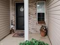 Cozy entryway with decorative accents, a 'Grandma & Grandpa's House' sign, and a charming welcome mat at 4233 Pearson Dr, Westfield, IN 46062