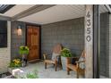 Welcoming front porch with chairs, plants, and house number displayed at 4350 Sylvan Rd, Indianapolis, IN 46228