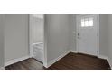 Welcoming foyer showcases a bright white door and a glimpse into the carpeted living space at 5076 Foxley Park Ln, Avon, IN 46123