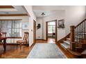 Elegant entryway with hardwood floors, staircase, and views into adjacent rooms, creating a warm welcome at 5194 Orahood Ct, Plainfield, IN 46168