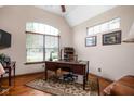 Bright home office featuring a classic wooden desk, hardwood floors, and large windows for natural light at 5194 Orahood Ct, Plainfield, IN 46168