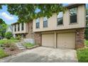 Inviting two-story home with brick and siding facade, complemented by a two-car garage and landscaped front yard at 5847 Democracy Dr, Indianapolis, IN 46254