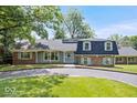 Classic home showcasing a well-manicured lawn and traditional architectural design at 6337 Cardinal Ln, Indianapolis, IN 46220