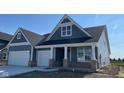 Charming blue home featuring white trim accents and a two-car garage, blending modern style and classic appeal at 6367 Stone Side Dr, Plainfield, IN 46168