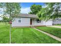 Charming one-story house featuring a well-kept lawn, tidy landscaping, and an attached garage at 6616 S Cross St, Pendleton, IN 46064