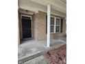 Close-up of the home's front porch, showcasing brick details and a covered entrance at 10523 Dark Star Dr, Indianapolis, IN 46234
