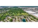 Aerial shot of a residential neighborhood with tree-lined streets and lush green spaces at 10938 E Mount Vernon N Trl, Indianapolis, IN 46229