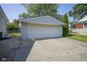 Spacious detached two-car garage with a concrete driveway and ample parking at 11 Sayre Dr, Greenwood, IN 46143