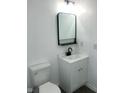 A stylish bathroom featuring modern fixtures, a sleek vanity, and a contemporary mirror at 12003 Broadway St, Indianapolis, IN 46236