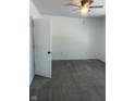 Bright bedroom with neutral walls, ceiling fan, and modern floors offers a calming retreat at 12003 Broadway St, Indianapolis, IN 46236