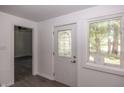Bright entryway featuring a decorative glass front door and a large window at 12003 Broadway St, Indianapolis, IN 46236
