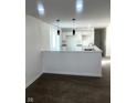 Bright, updated kitchen featuring white cabinets, granite countertops, and modern pendant lighting at 12003 Broadway St, Indianapolis, IN 46236