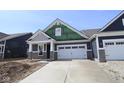 Attractive home showcasing gray siding, a two-car garage, and a well-designed facade perfect for curb appeal at 12524 Morning Ridge Way, Noblesville, IN 46060