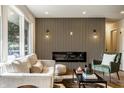 A stylish living room with a modern fireplace and comfortable seating at 130 N High School Rd, Indianapolis, IN 46214