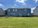 Expansive backyard with lush green grass, perfect for outdoor activities and relaxation at 1442 Bank Pl, Indianapolis, IN 46231
