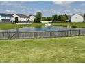 Picturesque pond with surrounding greenery, enhancing the natural beauty of the community at 1442 Bank Pl, Indianapolis, IN 46231