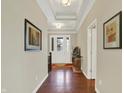 Inviting foyer with hardwood floors, elegant decor, and natural lighting at 1457 Birdsong Dr, Westfield, IN 46074