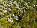 Residential neighborhood aerial shot including mature trees and multiple roof types at 16307 Stony Ridge Dr, Noblesville, IN 46060