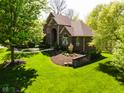 Beautiful brick home with lush landscaping and a well-maintained lawn at 16307 Stony Ridge Dr, Noblesville, IN 46060