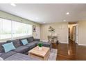 Cozy living room features a large sectional sofa, natural light, and stylish decor accents at 2170 N Old State Road 9, Columbus, IN 47203