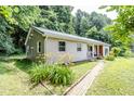 Single story home featuring durable metal roofing, light colored siding, and fresh landscaping at 2246 E Yellowwood Ln, Martinsville, IN 46151